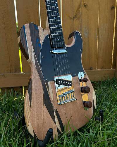 Close-up of the striped wood inlay on Scott's finished TE-style body