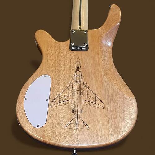 The custom "Bill Adam" nameplate mounted under the neck plate