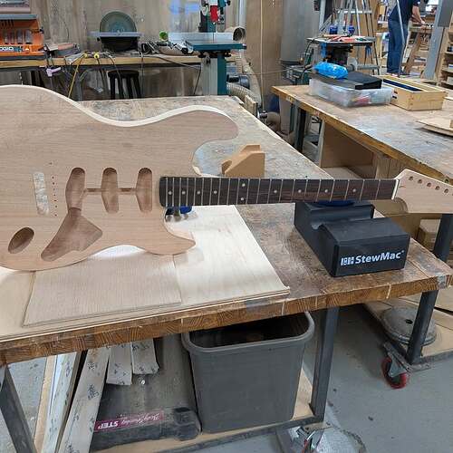 Students showing their finished guitars