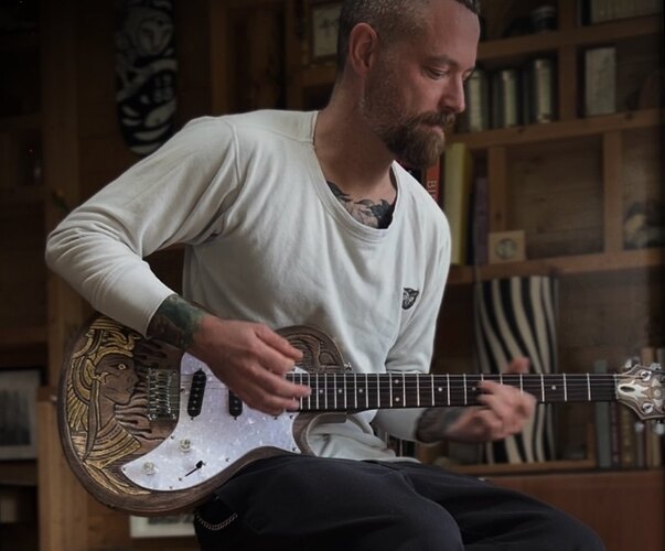 Peter-John playing his finished Ancient Egypt guitar