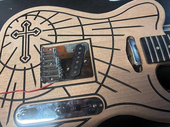 The finished hand-carved Faith guitar